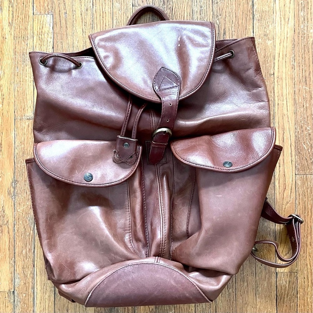 Vintage Wilson’s leather ol backpack with plaid lining